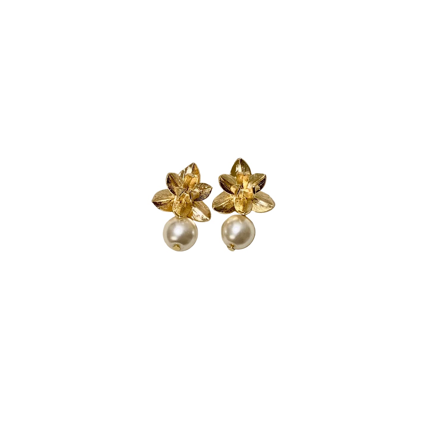 A pair of gold flower earrings with pearl drops, displayed against a neutral background.