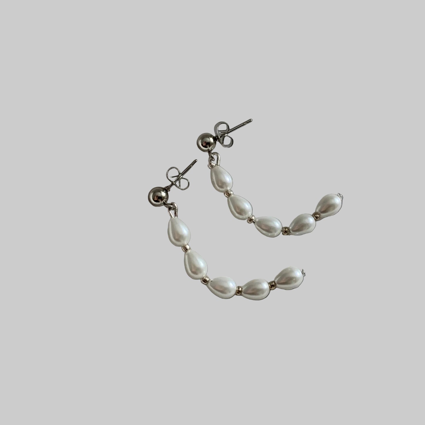 Pearl half-hoop earrings with silver ball posts